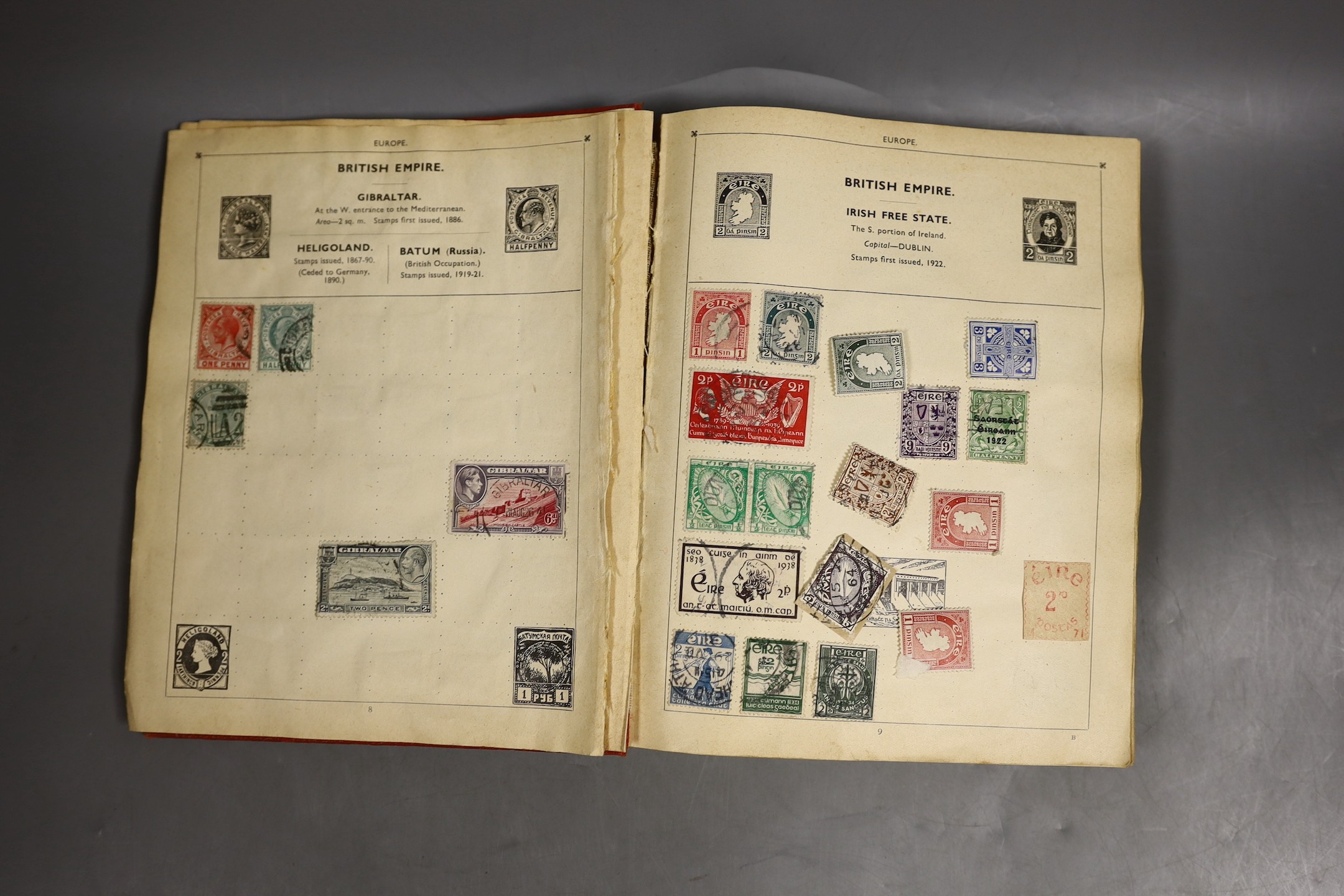 A stamp album of world stamps and a collection of loose stamps.